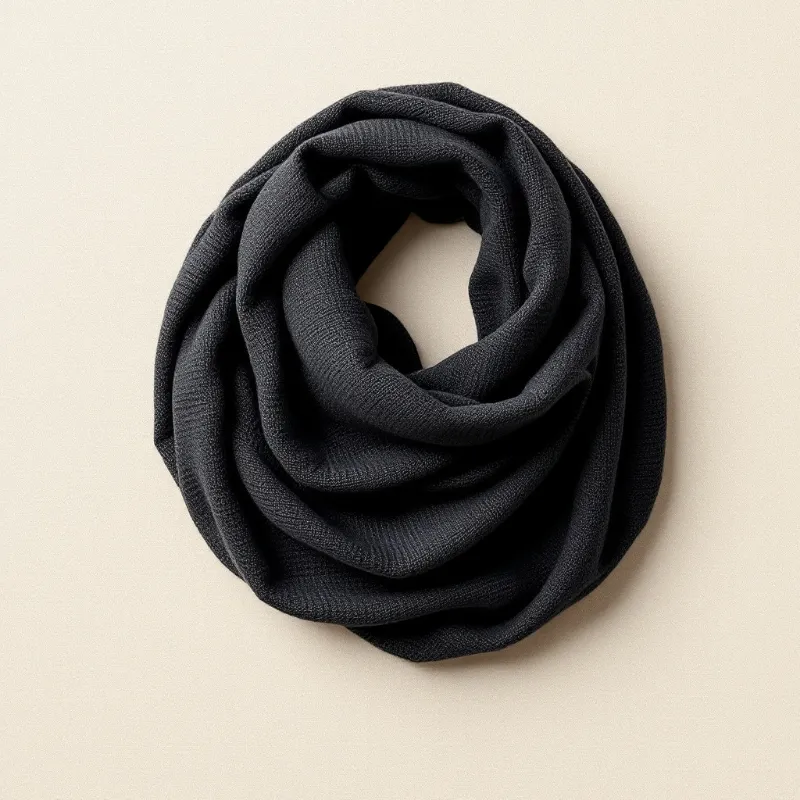 Illustration of a black merino wool triangle scarf